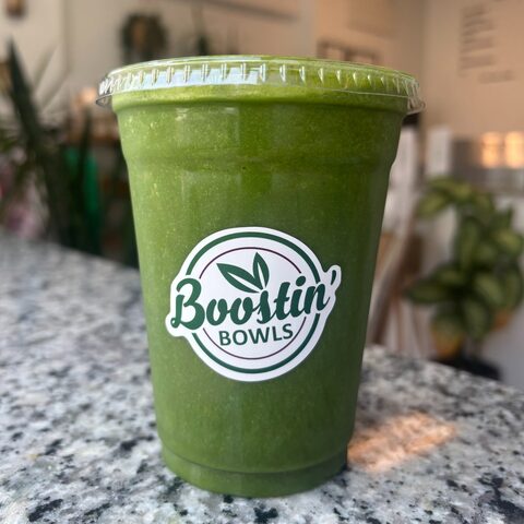 Green smoothie with almond milk, banana, spinach, flax powder, and honey